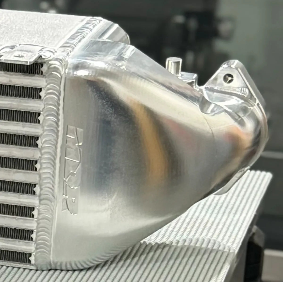 Angled view of MDR FL5 intercooler core with billet end tanks and weld quality